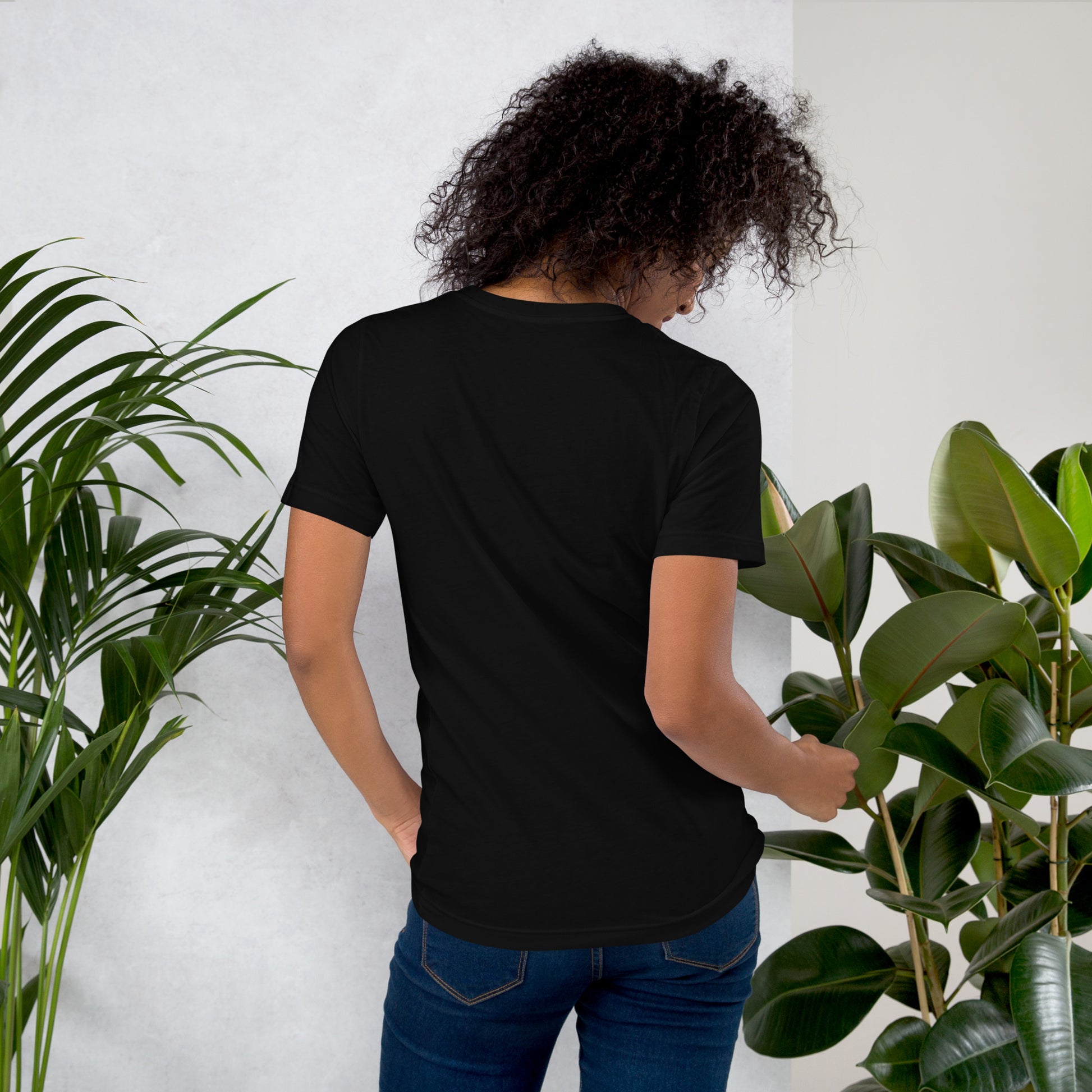 Back view of woman wearing black cotton graphic t-shirt