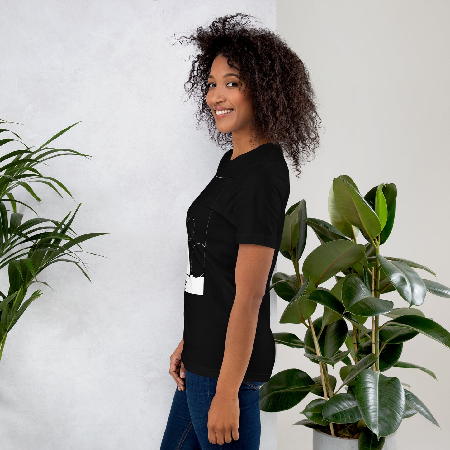 Side view of woman wearing black cotton graphic t-shirt