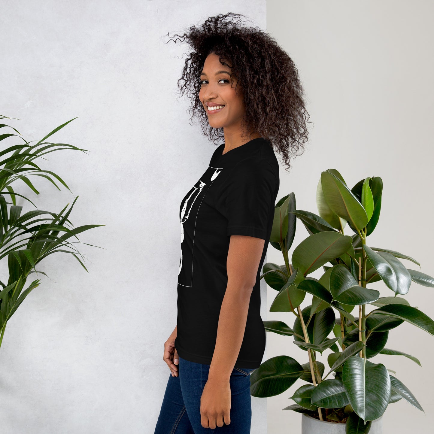 Side view of woman wearing black cotton graphic t-shirt