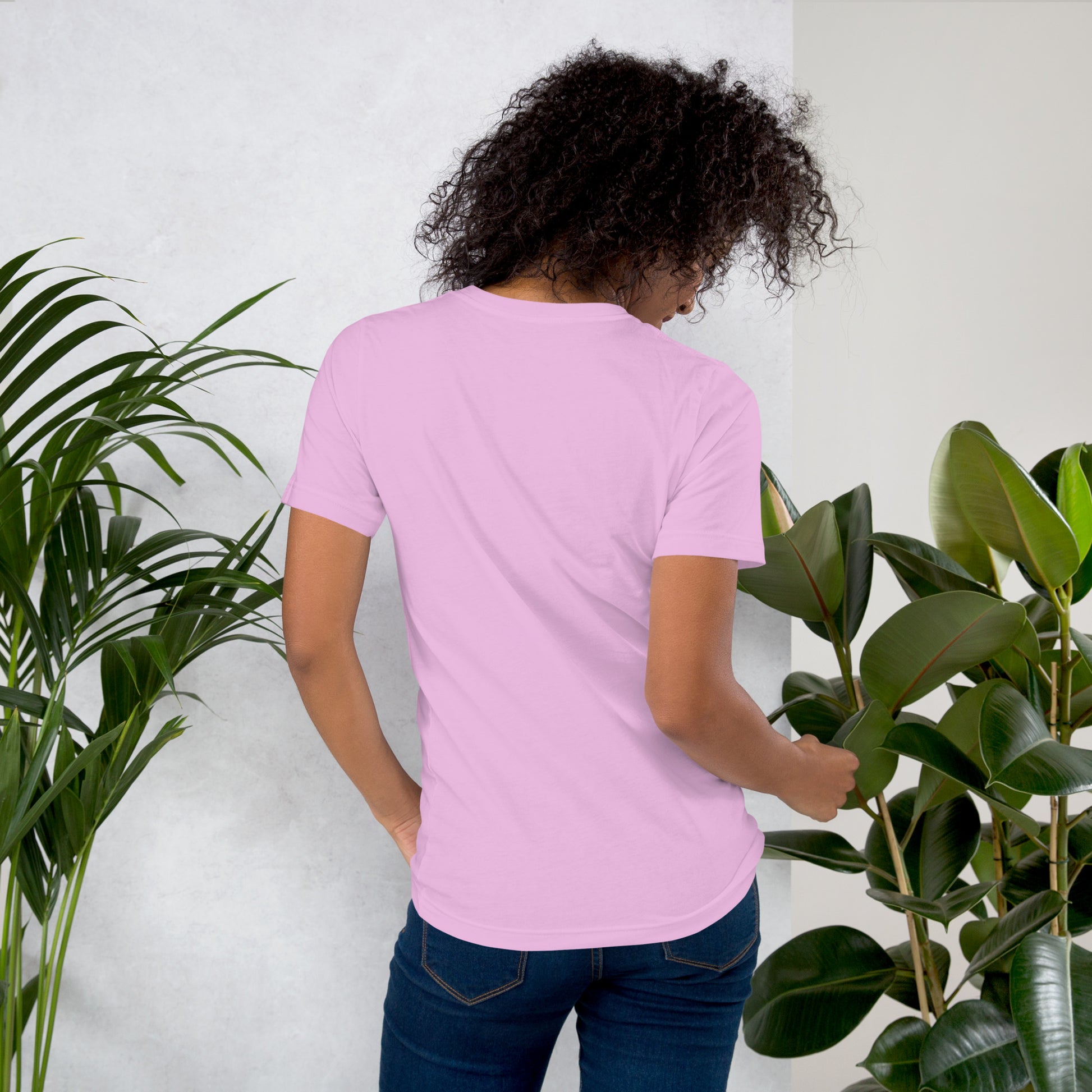 Back view of woman wearing pink cotton graphic t-shirt