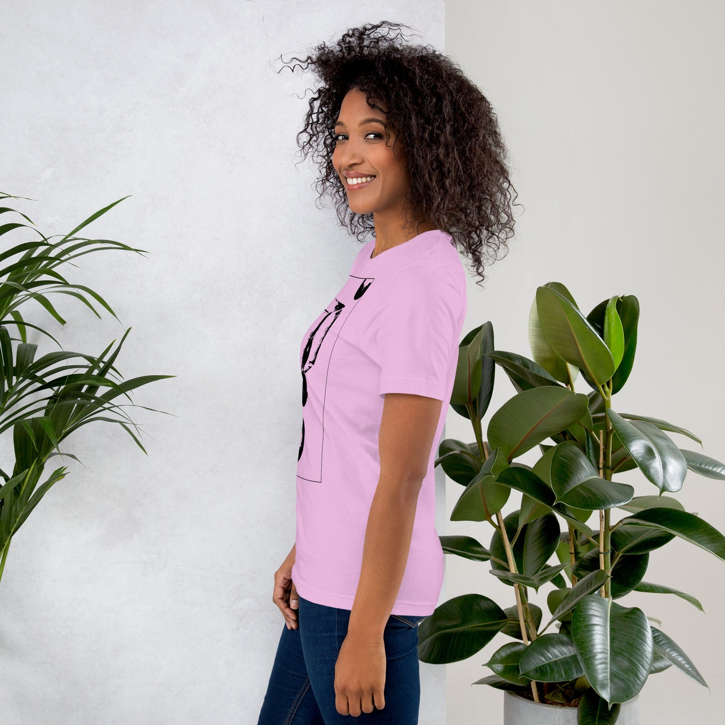 Side view of woman wearing pink cotton graphic t-shirt