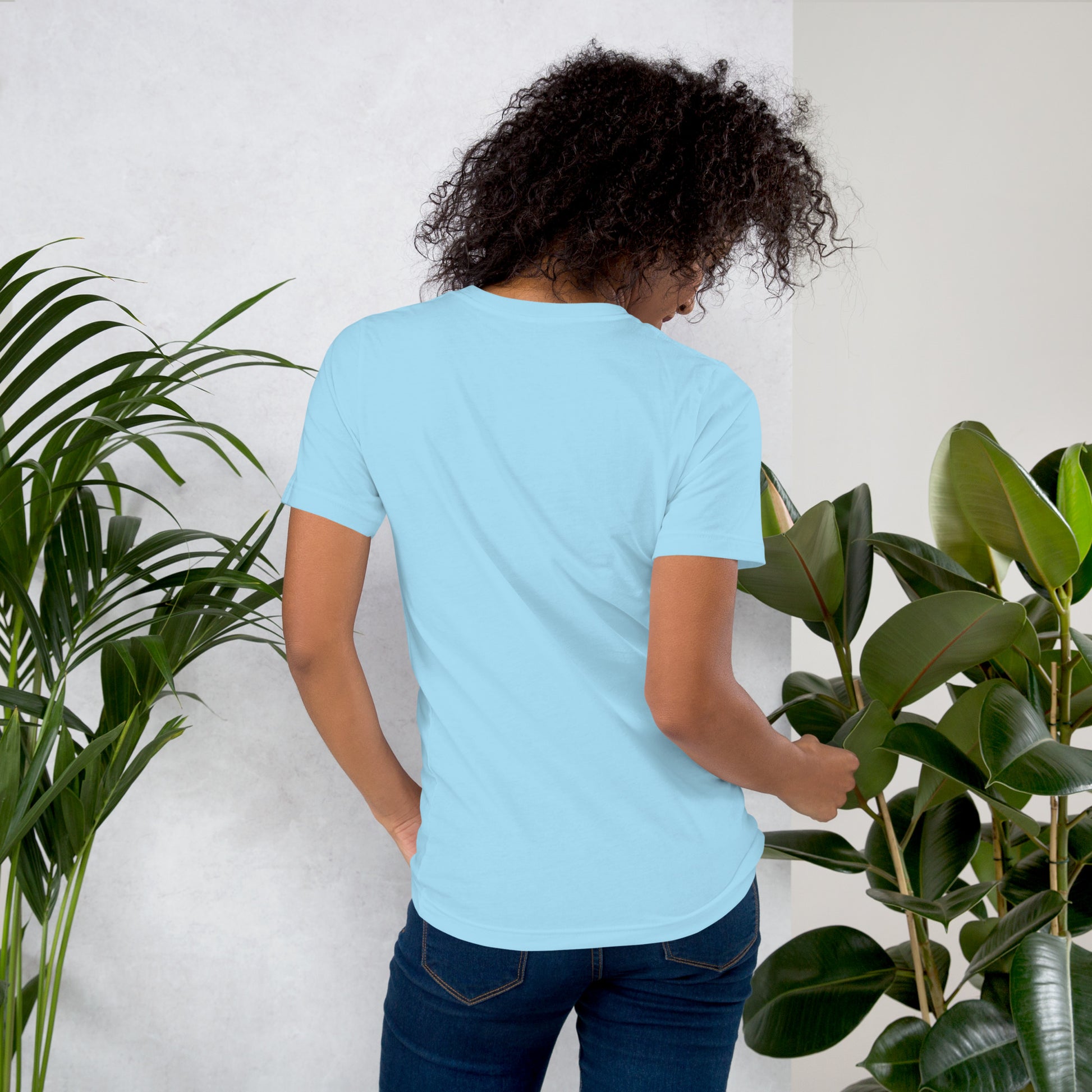 Back view of woman wearing blue cotton graphic t-shirt