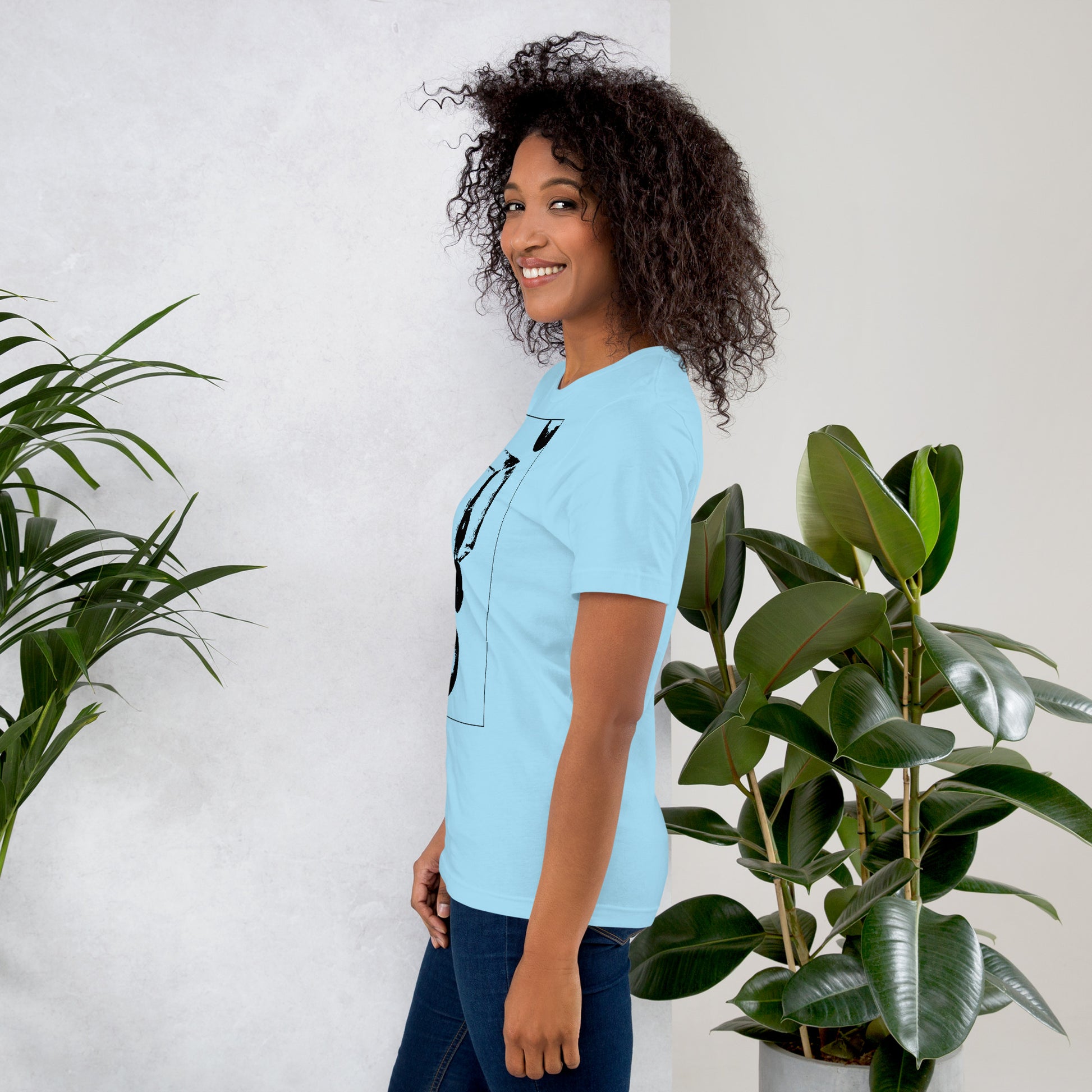 Side view of woman wearing blue cotton graphic t-shirt