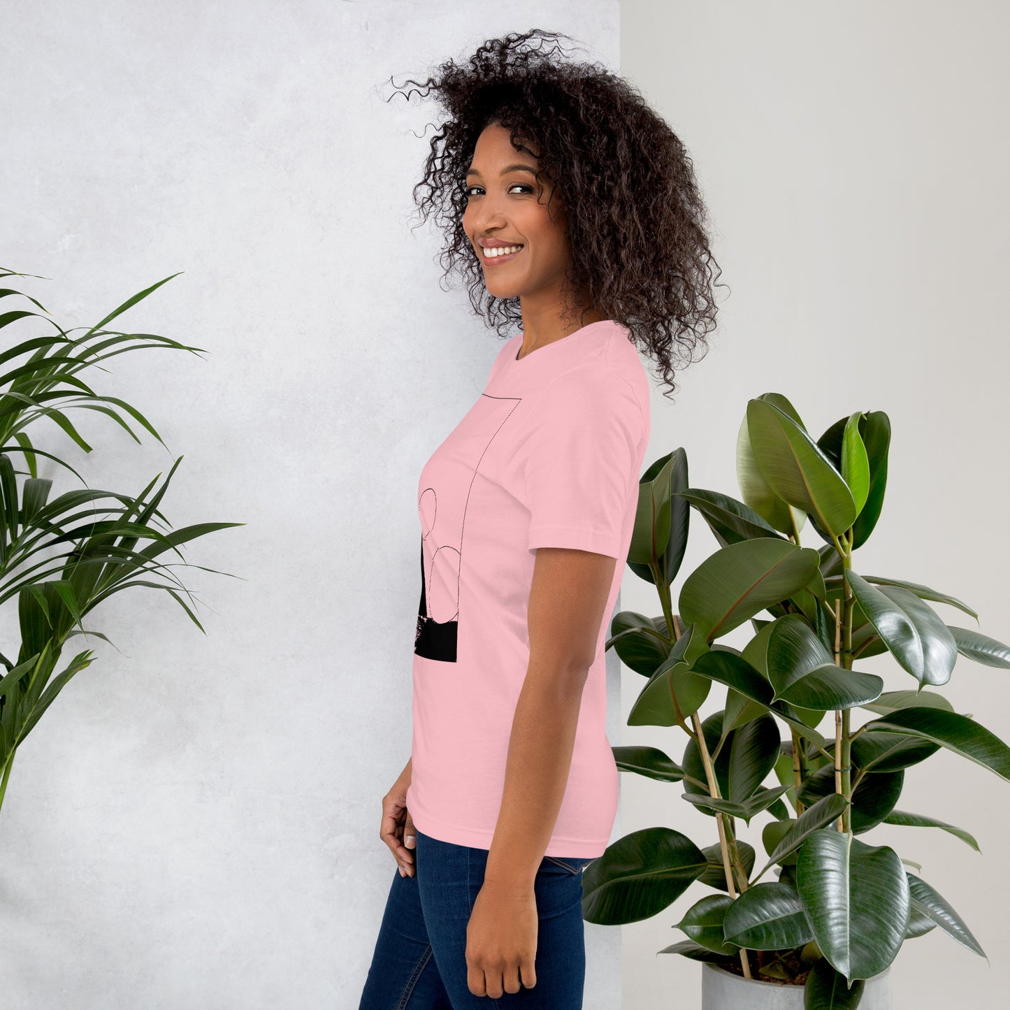 Side view of woman wearing coral cotton graphic t-shirt