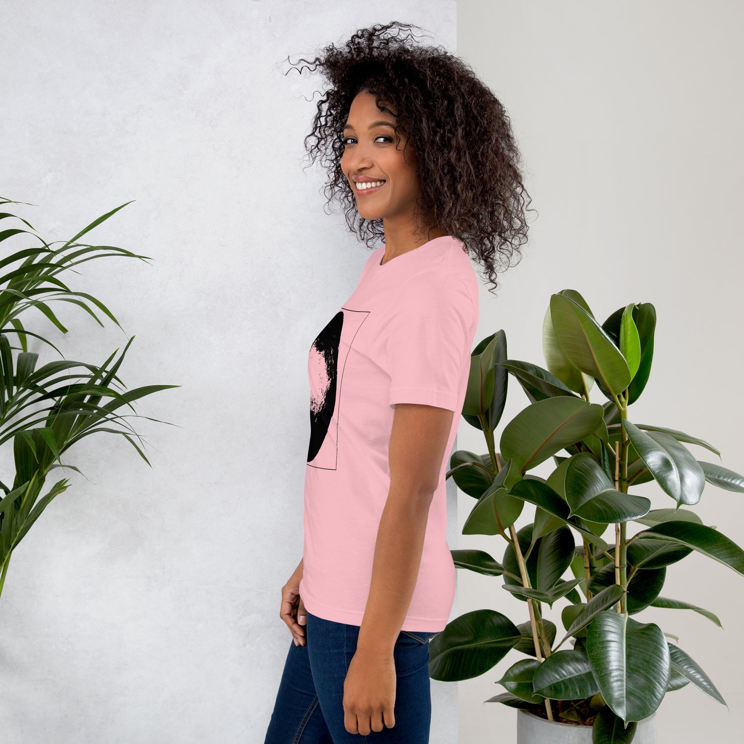 Side view of woman wearing coral cotton graphic t-shirt