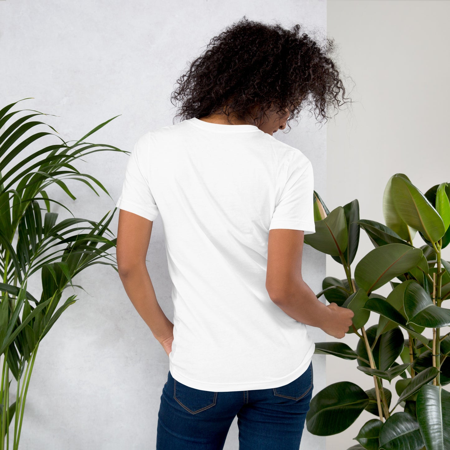 Back view of woman wearing white cotton graphic t-shirt