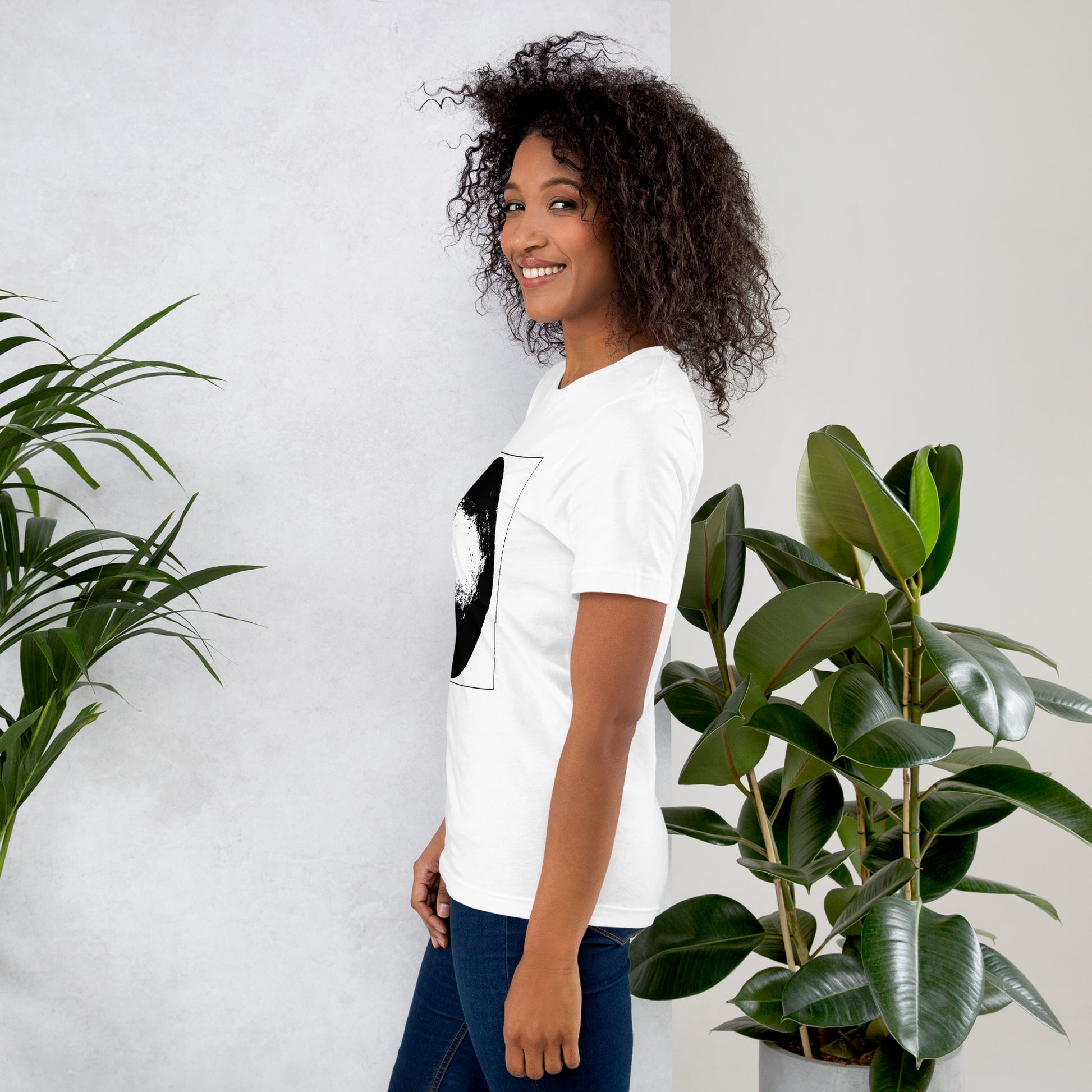 Side view of woman wearing white cotton graphic t-shirt