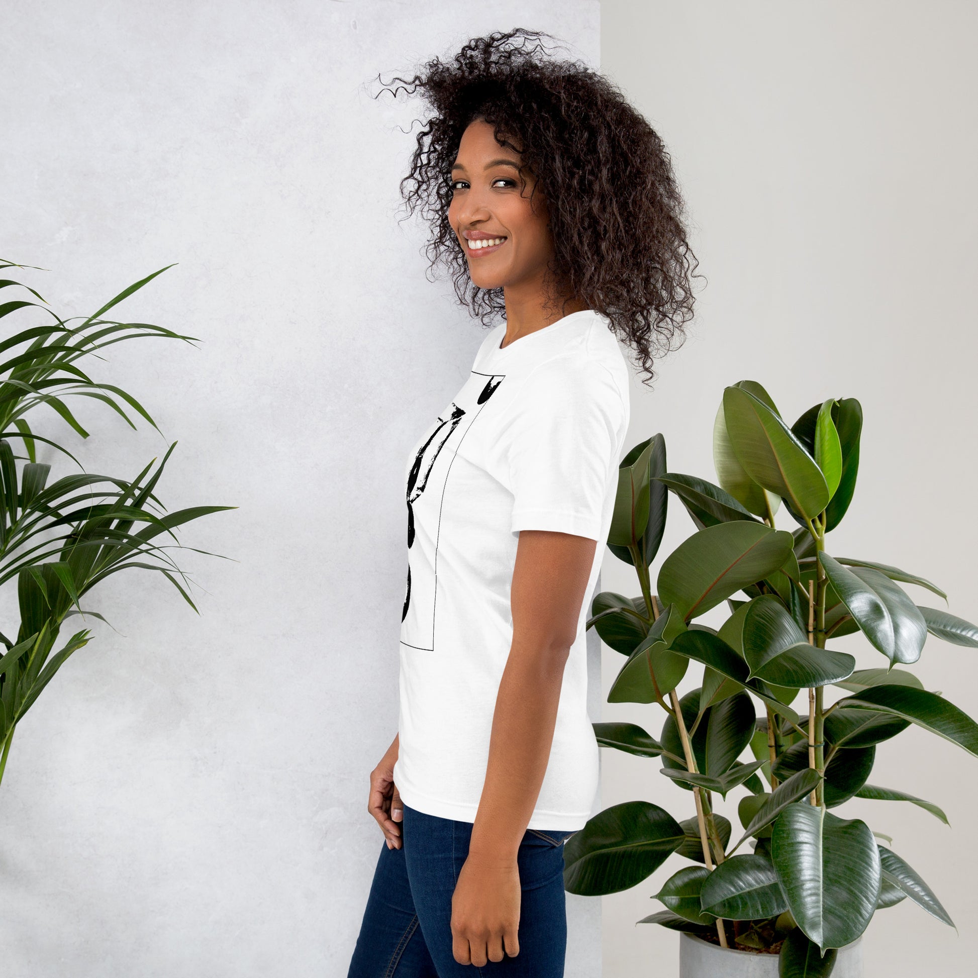 Side view of woman wearing white cotton graphic t-shirt